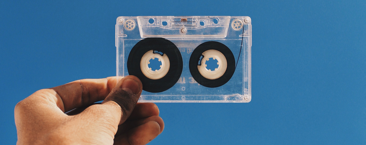 Hand holding cassette tape