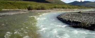 "Merging Waters". A glacial stream merges with a clear stream in the Noatak River drainage. Credit: Gates Of The Arctic National Park & Preserve, National Park Service, public domain.