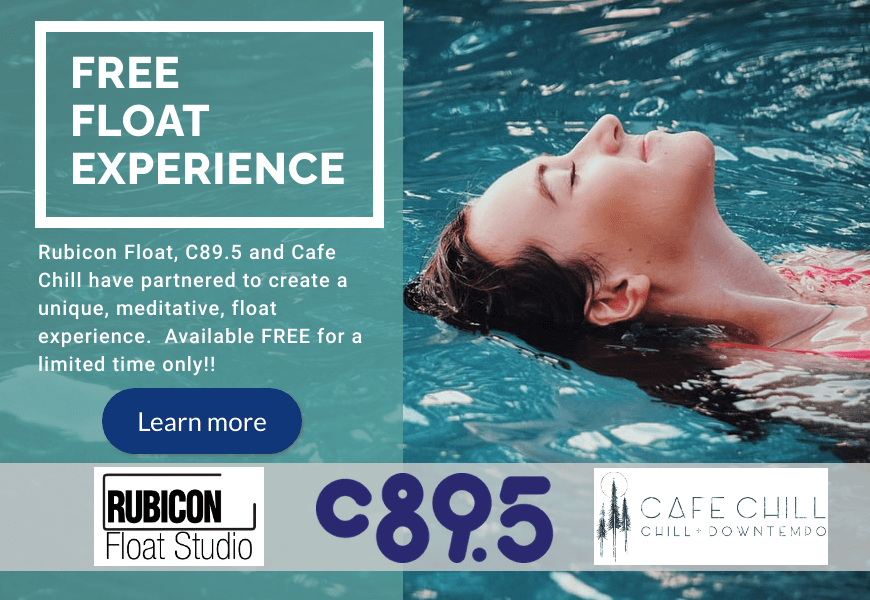A woman floating in blue water. The words "Free Float Experience. Rubicon Float, C895 and Cafe Chill have partnered to create a uniquue, meditative, float experience. Available FREE for a limited time only!" followed by the logos for Rubicon Float Studio, C895 and Cafe Chill.
