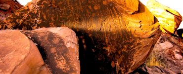 A sun-lit panel of petroglyphs during summer solstice.