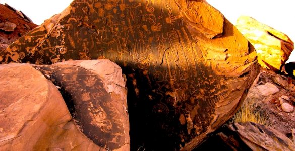 A sun-lit panel of petroglyphs during summer solstice.