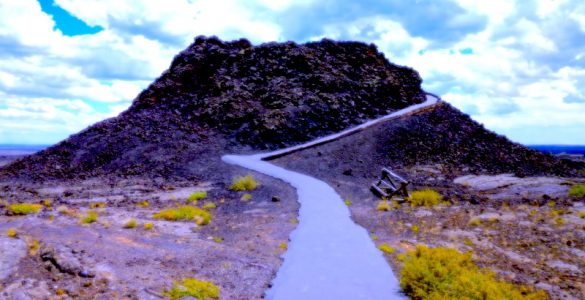 A small volcano cone with a paved trail leading up the perimeter.