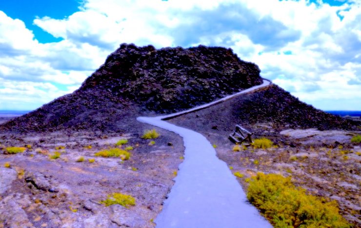 A small volcano cone with a paved trail leading up the perimeter.