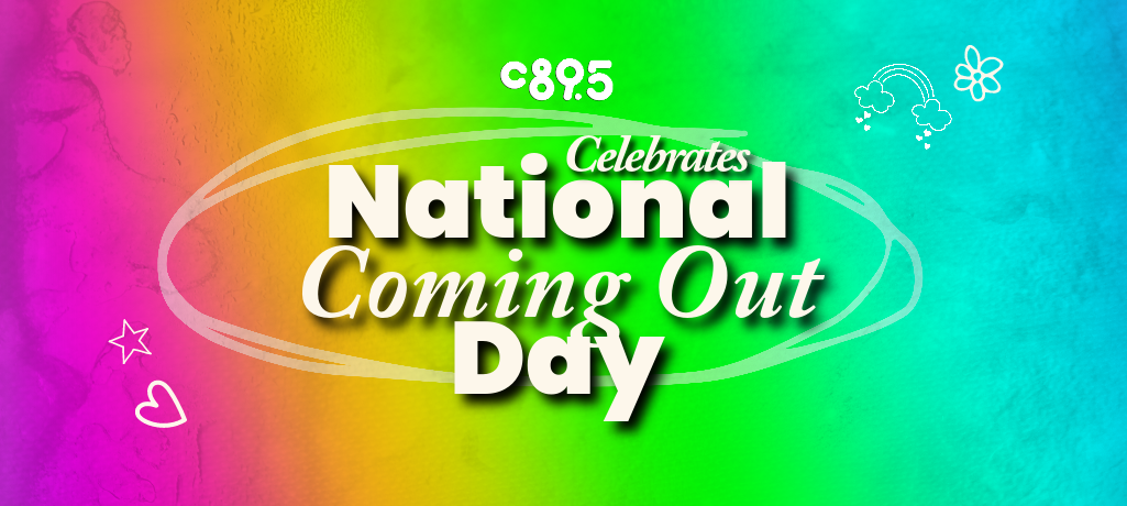A rainbow background with the words "C895 Celebrating National Coming Out Day"