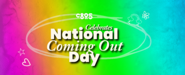 A rainbow background with the words "C895 Celebrating National Coming Out Day"