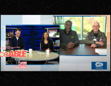 A screeshot image of the two anchor of "ARC Seattle" on KOMO TV sitting behind a desk along with another shot of Ron Chatman and a representative from the Museum of Flight with the words "danceABLE"