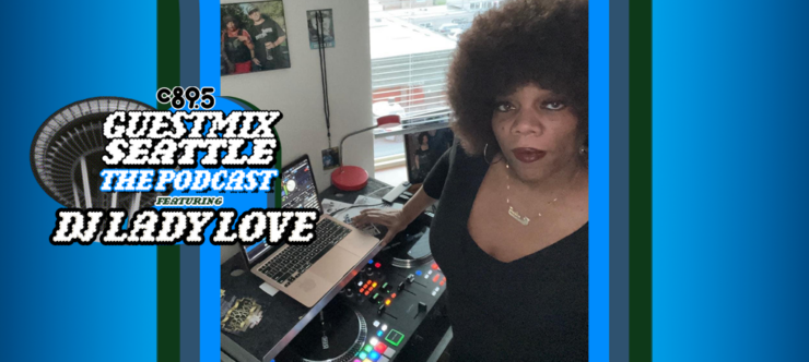 Woman standing at a DJ station with a microphone and laptop, displaying a music software interface. A large round logo with text: "Guest Mix Seattle The Podcast DJ Lady Love" overlays part of the image. There are framed pictures in the background and an interior setting is visible.