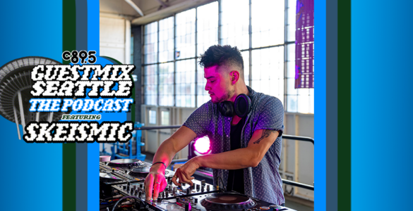 DJ Skeismic performing at a mixer table during a live session for the C89.5 Guestmix Seattle podcast in a room with large windows.