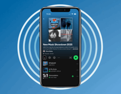 A smartphone displaying the Spotify app with a 'New Music Showdown 2025' playlist on the screen, against a blue background.