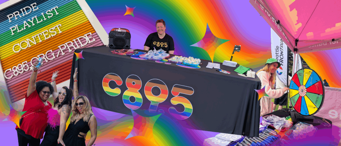 Promotional event for C895 at a Pride celebration, featuring a DJ booth, attendees spinning a prize wheel, and colorful decorations including rainbow motifs.