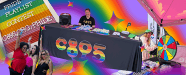 Promotional event for C895 at a Pride celebration, featuring a DJ booth, attendees spinning a prize wheel, and colorful decorations including rainbow motifs.