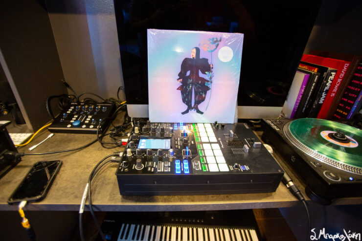 Vinyl records and album covers featuring TOKiMONSTA displayed on a shelf.