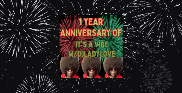 Image celebrating the 1-year anniversary of 'It's A Vibe #WorldLadyLove' with vibrant fireworks in the background and a central banner featuring colorful text and repeated images of a person wearing large sunglasses