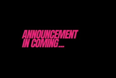 Black background with "Announcement in coming..." in bright pink