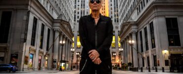 Industrial music artist Bill Leeb standing in a cityscape