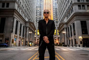 Industrial music artist Bill Leeb standing in a cityscape