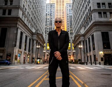 Industrial music artist Bill Leeb standing in a cityscape