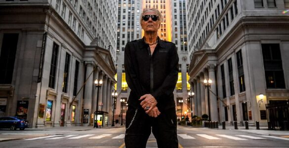 Industrial music artist Bill Leeb standing in a cityscape