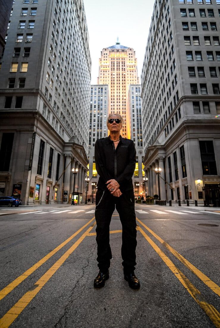 Industrial music artist Bill Leeb standing in a cityscape