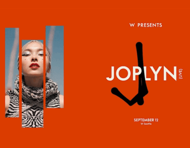 Promotional banner featuring a close-up of an individual with bold lipstick and a patterned outfit, for a JOPLYN event presented by W, scheduled for September 12. The background is vibrant orange with a minimalist logo design.