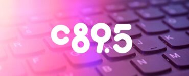 Close-up view of a keyboard with the letters and numbers 'C 8 9 . 5' highlighted in a glowing purple hue.