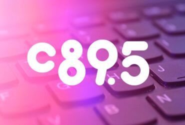 Close-up view of a keyboard with the letters and numbers 'C 8 9 . 5' highlighted in a glowing purple hue.