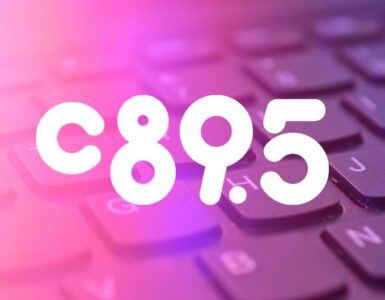 Close-up view of a keyboard with the letters and numbers 'C 8 9 . 5' highlighted in a glowing purple hue.