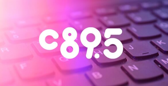 Close-up view of a keyboard with the letters and numbers 'C 8 9 . 5' highlighted in a glowing purple hue.