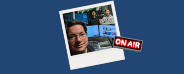 A polaroid photo of Drew Bailey and two students on air in the c895 studios