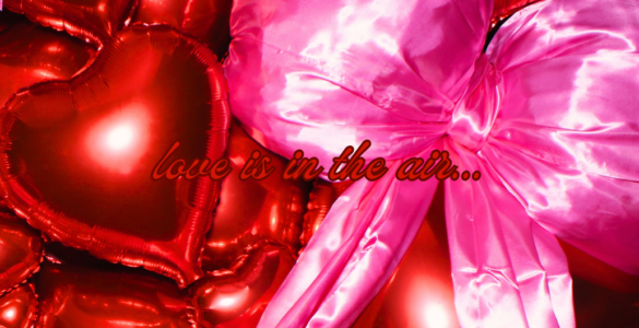 An array of shiny red heart-shaped balloons with a prominent pink bow, featuring the phrase "love is in the air..." floating amidst them.