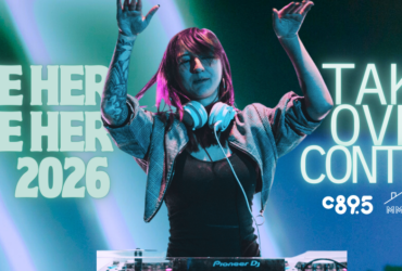 A female DJ with her hands in the air and the words "See her Be her 2026 Take Over Contest"