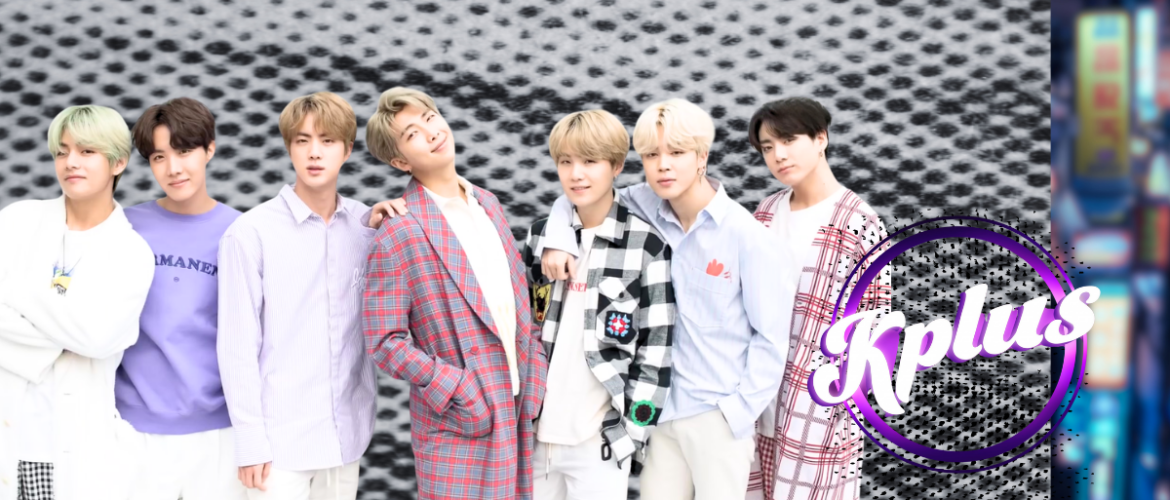 A group of people stand in a row, smiling, against a textured black and white background. They are dressed in stylish, colorful outfits. To the right, the word "Kplus" is displayed in a purple circle.