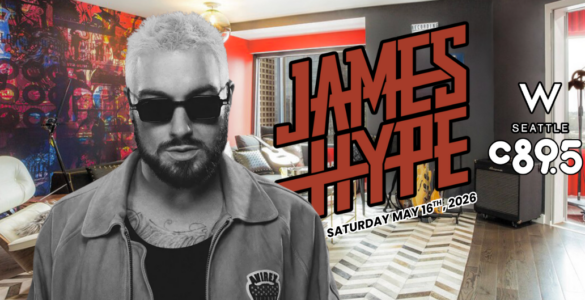 A person wearing sunglasses and a casual jacket is in the foreground, with a colorful, music-themed backdrop. In bold red letters, "James Hype" is displayed. Logos for "W Seattle" and "C 89.5" are visible. The date "Saturday, May 16th, 2026" is also included.