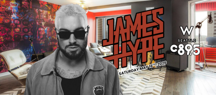 A person wearing sunglasses and a casual jacket is in the foreground, with a colorful, music-themed backdrop. In bold red letters, "James Hype" is displayed. Logos for "W Seattle" and "C 89.5" are visible. The date "Saturday, May 16th, 2026" is also included.