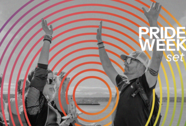 A grayscale image shows two people with arms raised in celebration. Bright, colorful concentric circles overlay the image. The text reads "C89.5 Pride Mix Weekend Fri-Sunday," and in the lower left corner, "presented by National Nordic Museum.