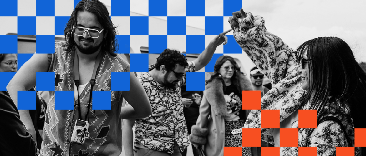 A group of people enjoy dancing with lively expressions. A person in the foreground wears large glasses and a camera around their neck. The image has a checkerboard overlay pattern in blue and orange squares.